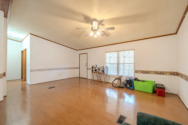a kitchen with stainless steel appliances a refrigerator and a stove
