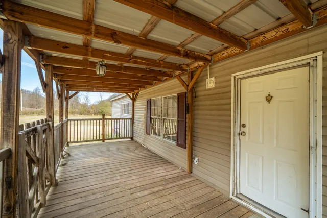 a view of hallway with wooden floor