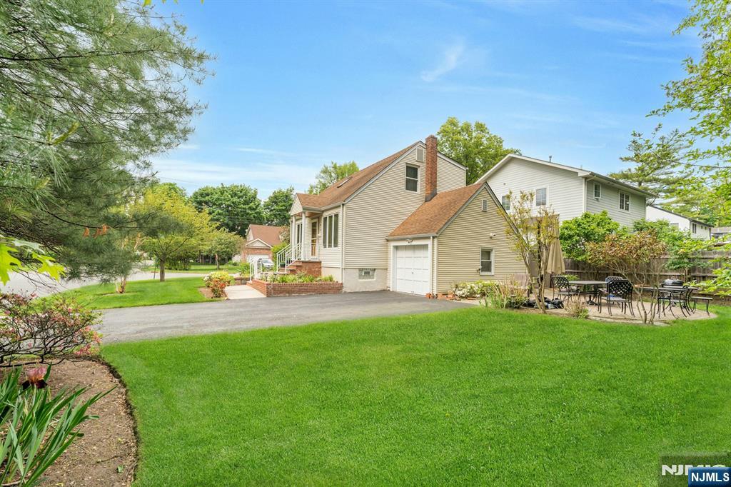 24 Cambridge Road Tenafly, NJ 07670 - Photo 31 of 31 a view of a house with a yard and sitting area