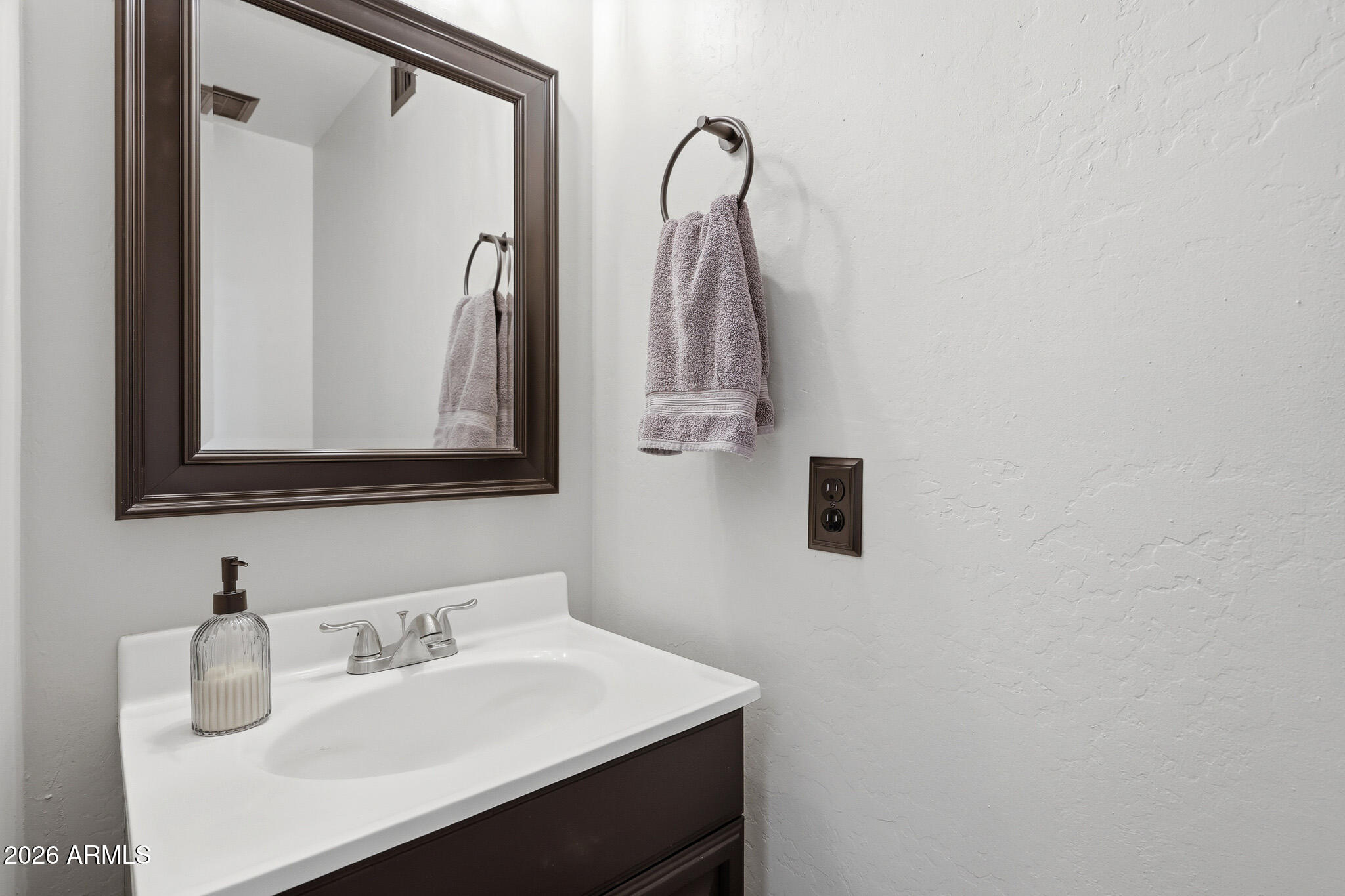 2167 East Nighthawk Way Phoenix, AZ 85048 - Photo 16 of 28 a bathroom with a sink vanity and a mirror