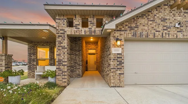 a view of entryway with brick walls