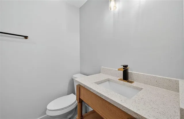 a bathroom with a sink a toilet
