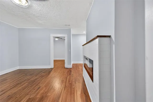a view of a room with wooden floor and staircase
