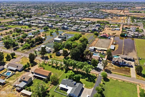 an aerial view of residential houses with outdoor space