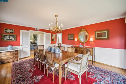 a kitchen with a table and chairs in it