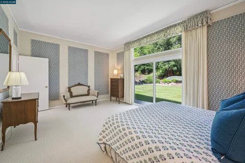 a bedroom with a bed and lamp