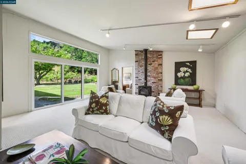 a living room with furniture and next to a window
