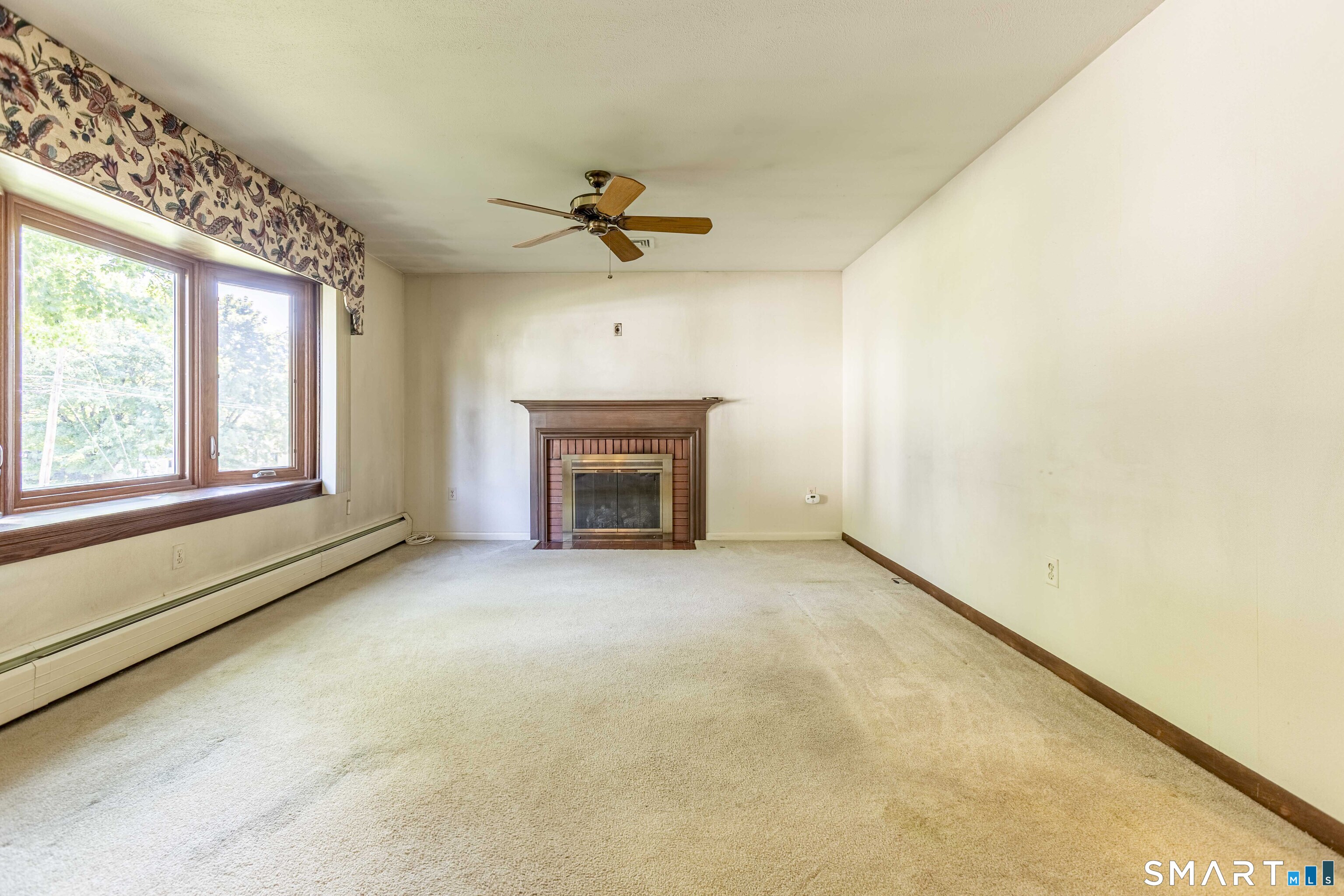 16 Philip Road Manchester, CT 06040 - Photo 6 of 23 Living Room with Bay window and Gas Fireplace