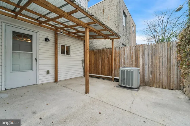 a view of a porch with a wooden fence