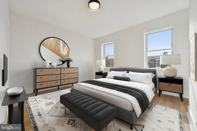 a bedroom with bed and a chandelier