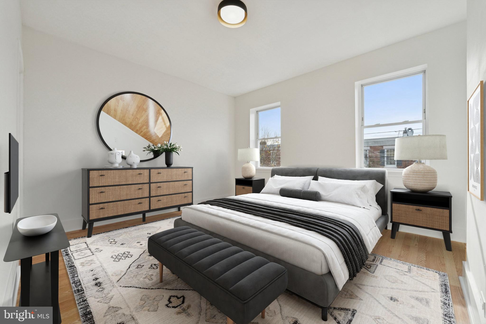 2353 East Huntingdon Street Philadelphia, PA 19125 - Photo 12 of 42 a bedroom with bed and a chandelier