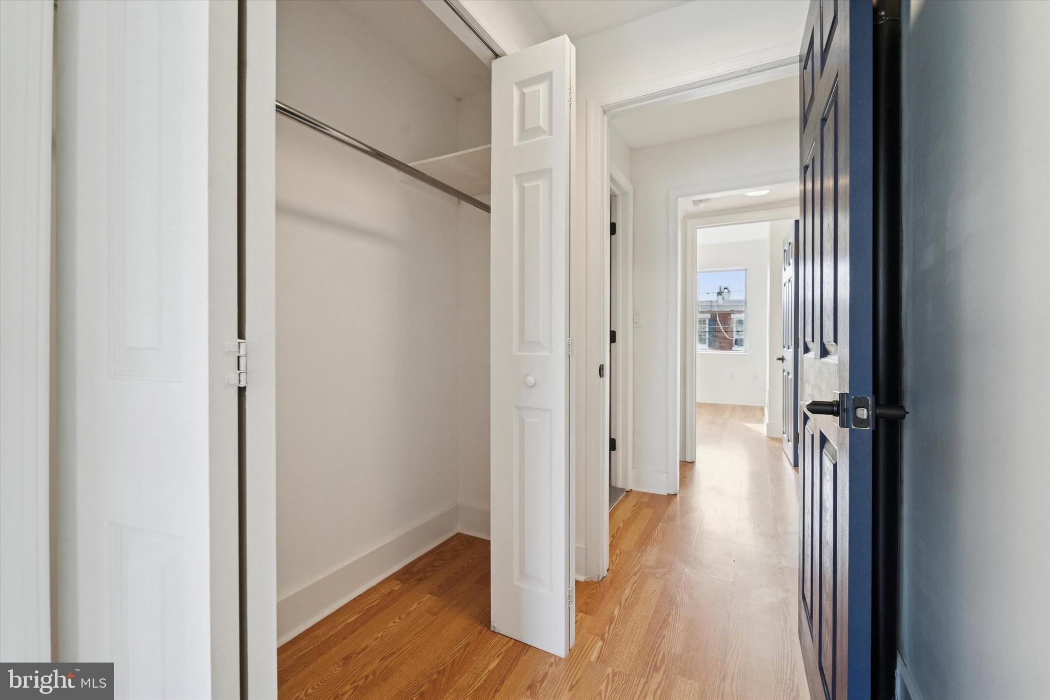 2353 East Huntingdon Street Philadelphia, PA 19125 - Photo 15 of 42 a view of a hallway with wooden floor and closet area