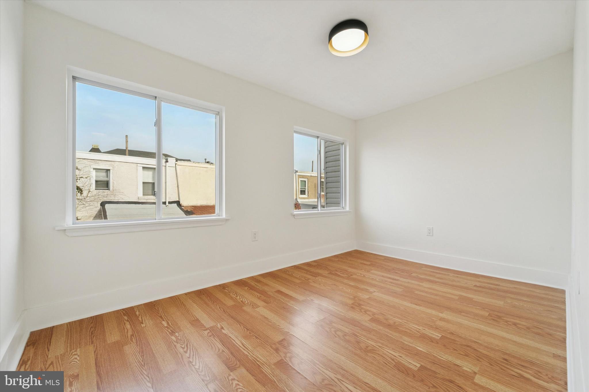 2353 East Huntingdon Street Philadelphia, PA 19125 - Photo 16 of 42 an empty room with windows