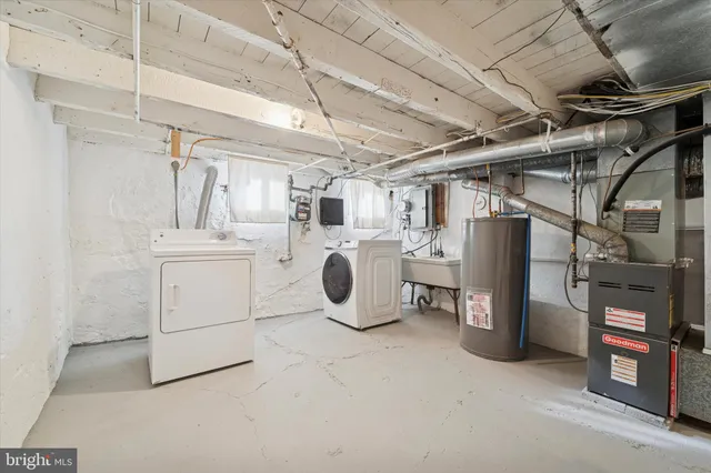 a view of a storage & utility room with washer and dryer