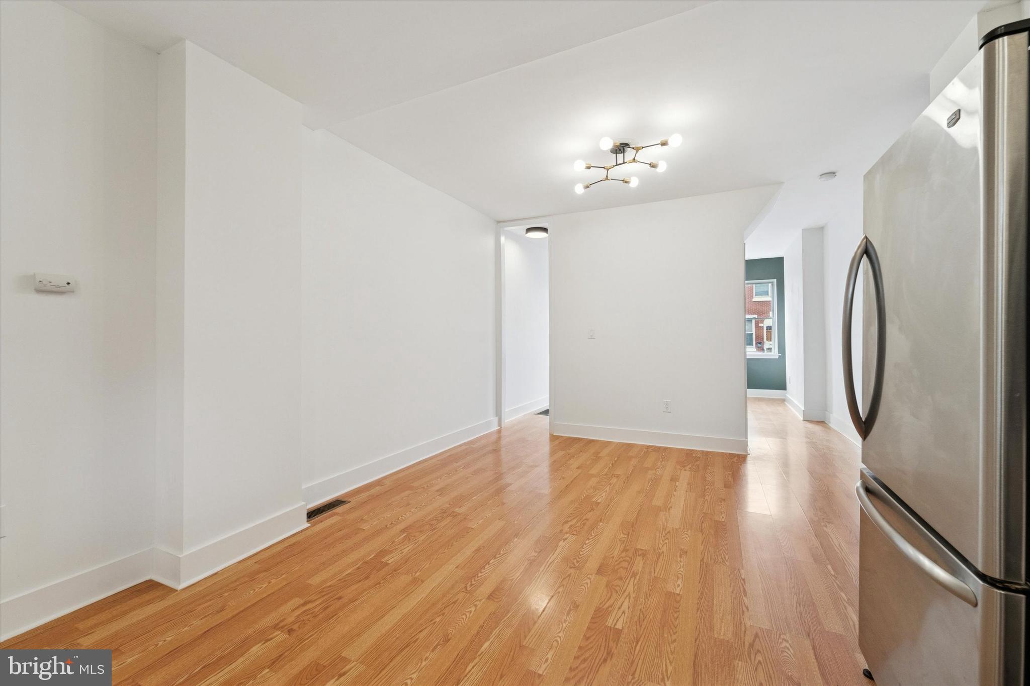 2353 East Huntingdon Street Philadelphia, PA 19125 - Photo 26 of 42 a view of an empty room with wooden floor and a window