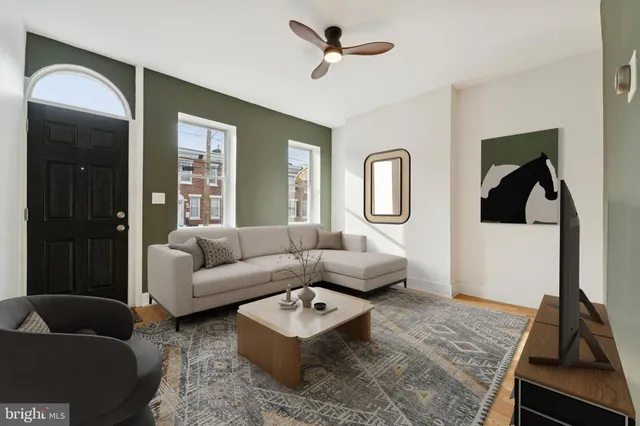 a living room with furniture and a rug