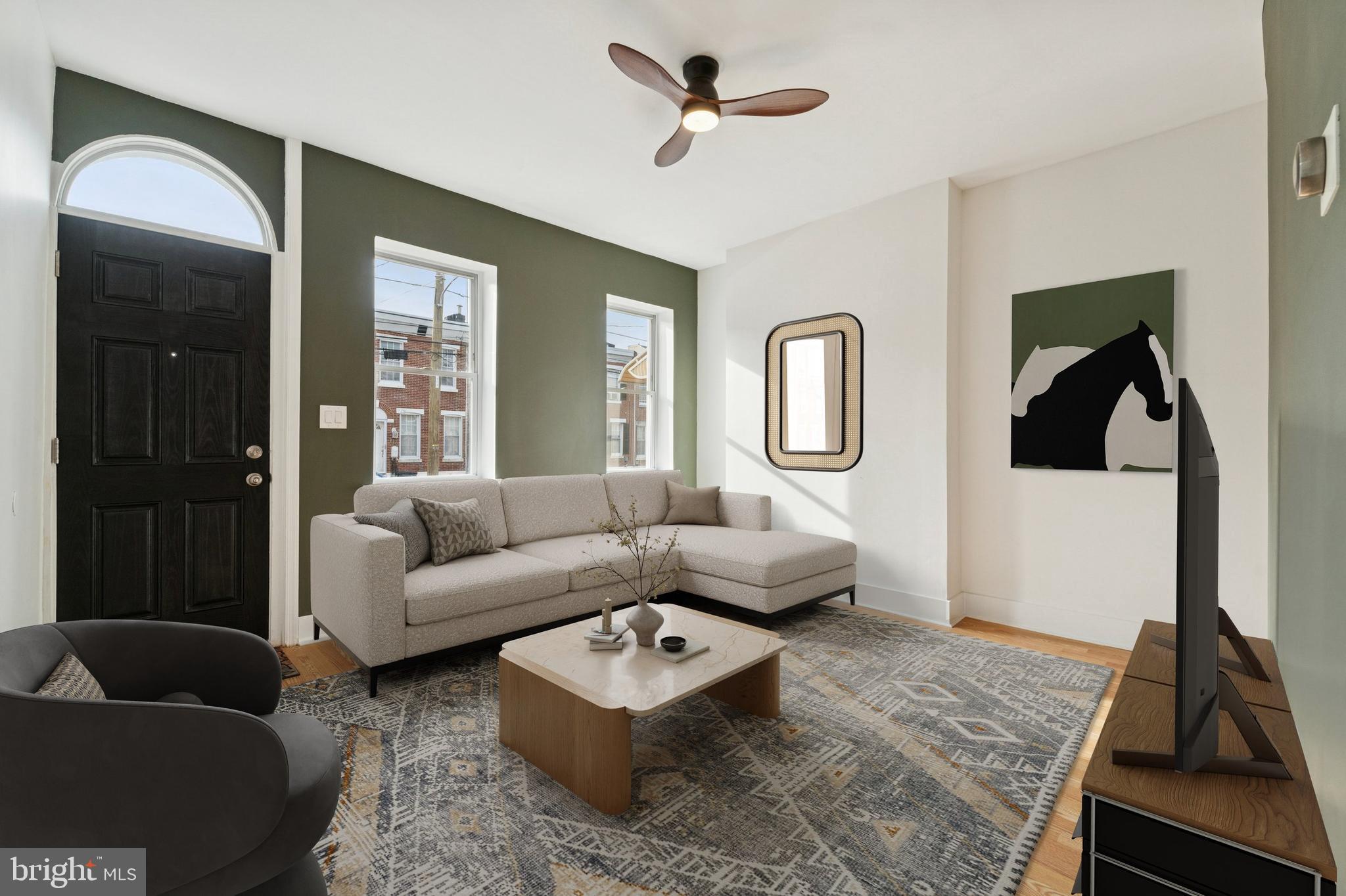 2353 East Huntingdon Street Philadelphia, PA 19125 - Photo 3 of 42 a living room with furniture and a rug