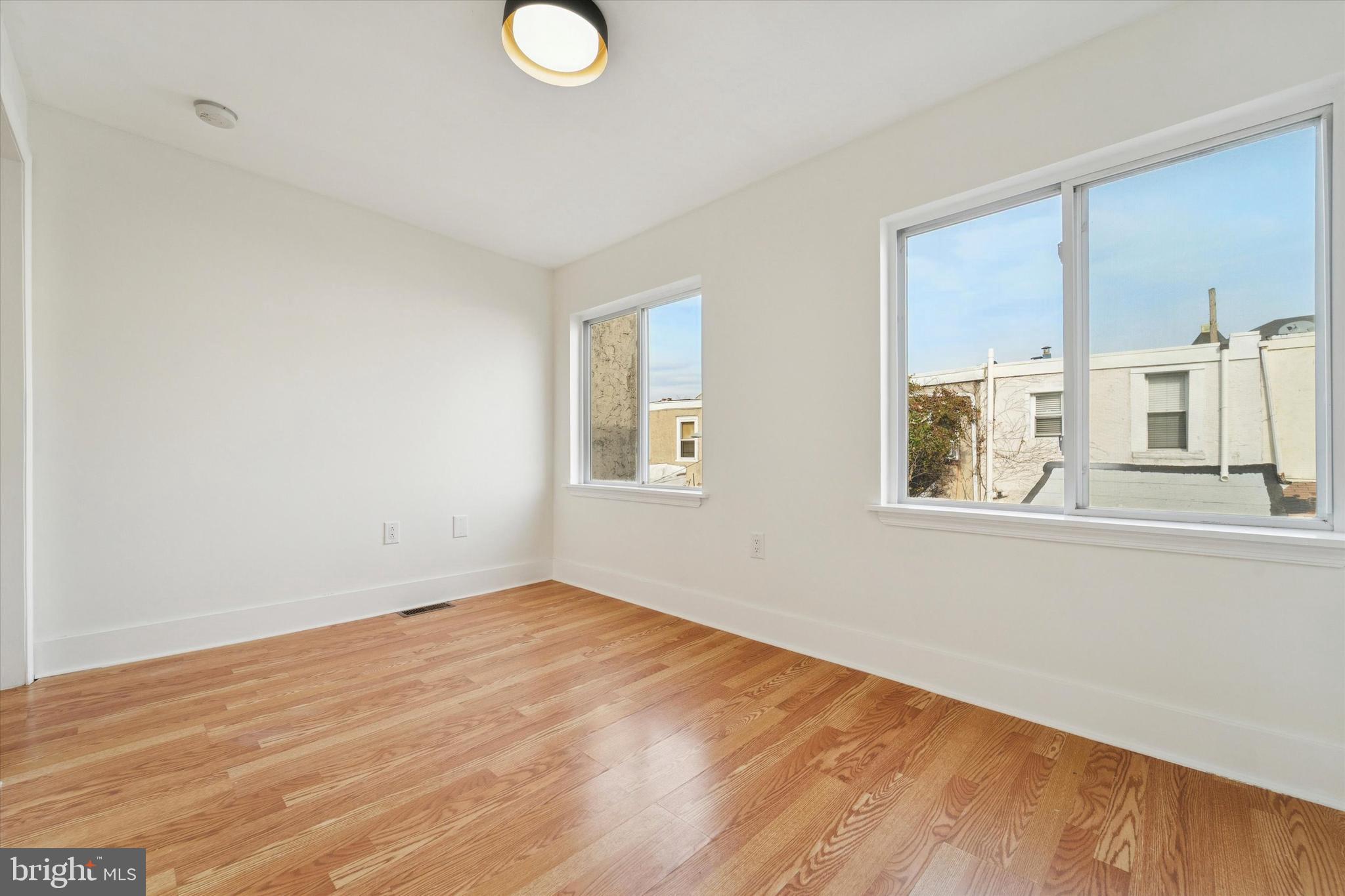 2353 East Huntingdon Street Philadelphia, PA 19125 - Photo 37 of 42 a view of empty room with wooden floor and window