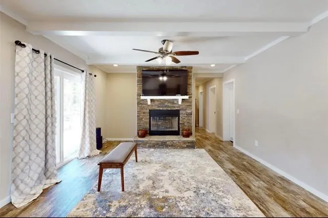 a living room with furniture and a fireplace