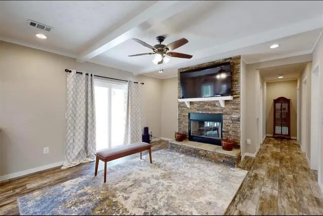 a living room with furniture and a fireplace