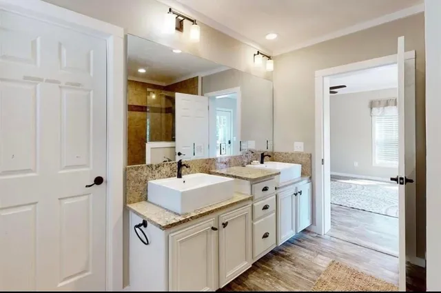 a bathroom with a sink and a mirror