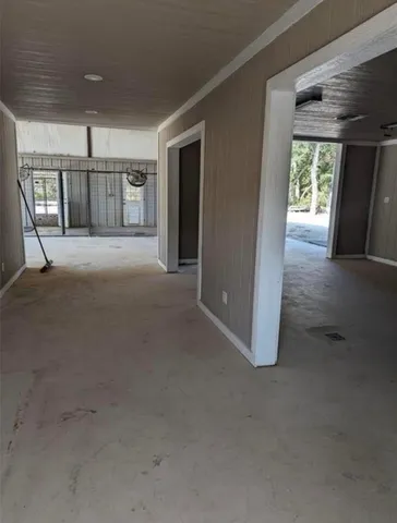 a view of an empty room with a fireplace