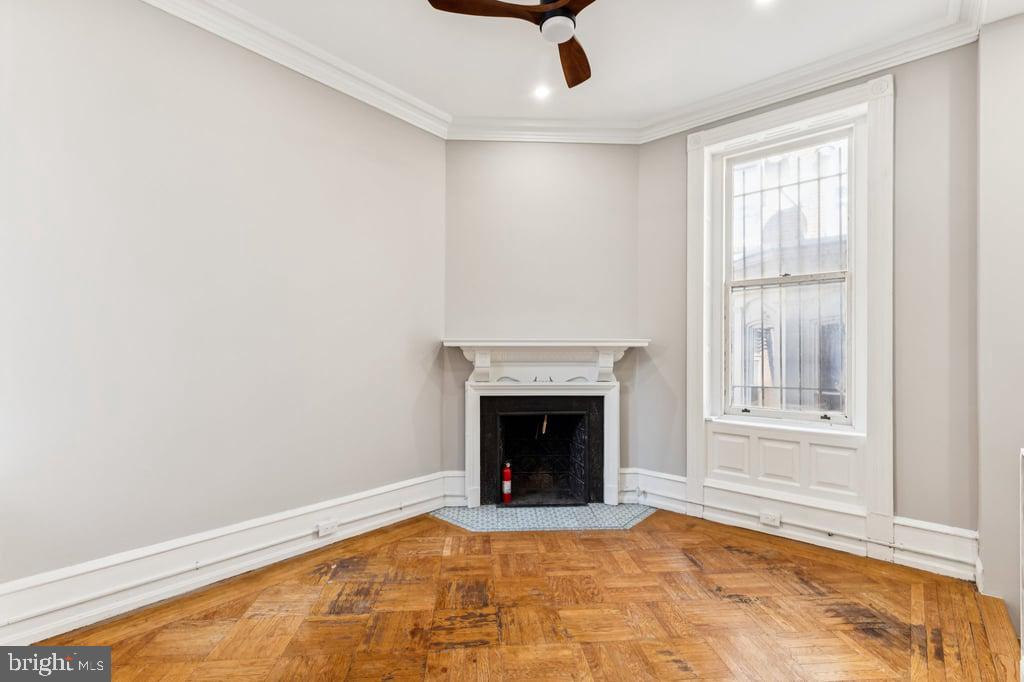 2101 Spruce Street, Unit 2R Philadelphia, PA 19103 - Photo 24 of 28 a view of an empty room with a fireplace and a window