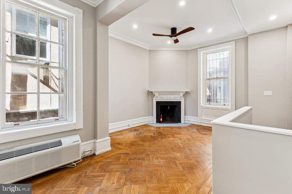 2101 Spruce Street, Unit 2R Philadelphia, PA 19103 - Photo 25 of 28 a view of an empty room with a fireplace and a window