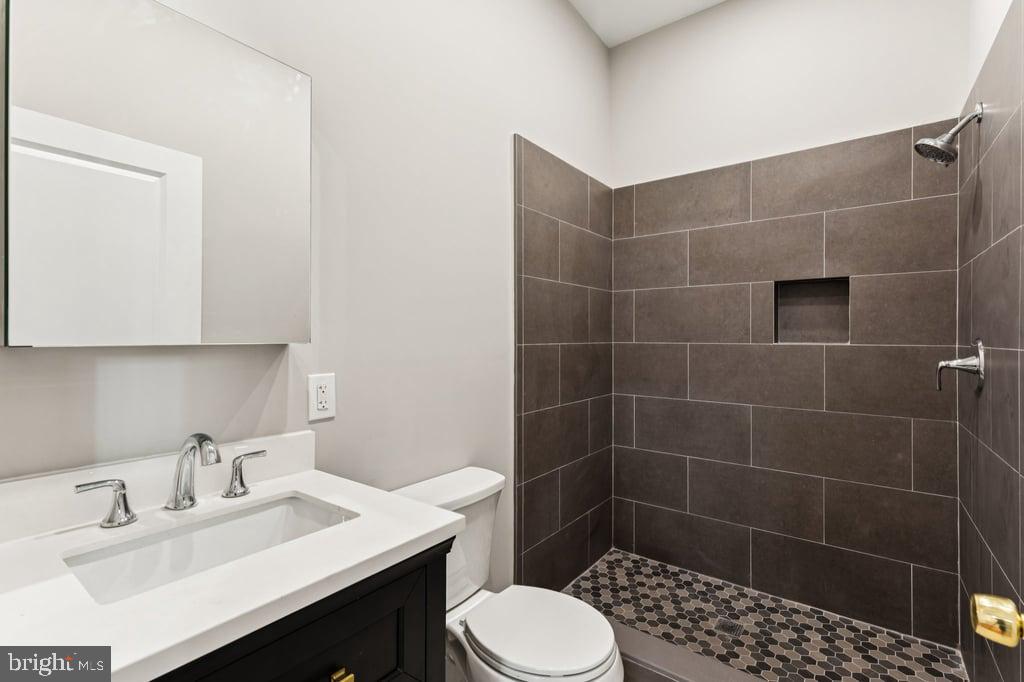 2101 Spruce Street, Unit 2R Philadelphia, PA 19103 - Photo 28 of 28 a bathroom with a sink toilet and shower