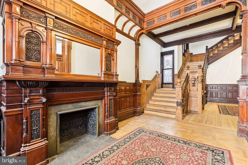 2101 Spruce Street, Unit 2R Philadelphia, PA 19103 - Photo 5 of 28 a view of a porch with wooden floor and a fireplace