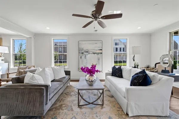 a living room with furniture and white walls