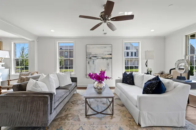 a living room with furniture and white walls