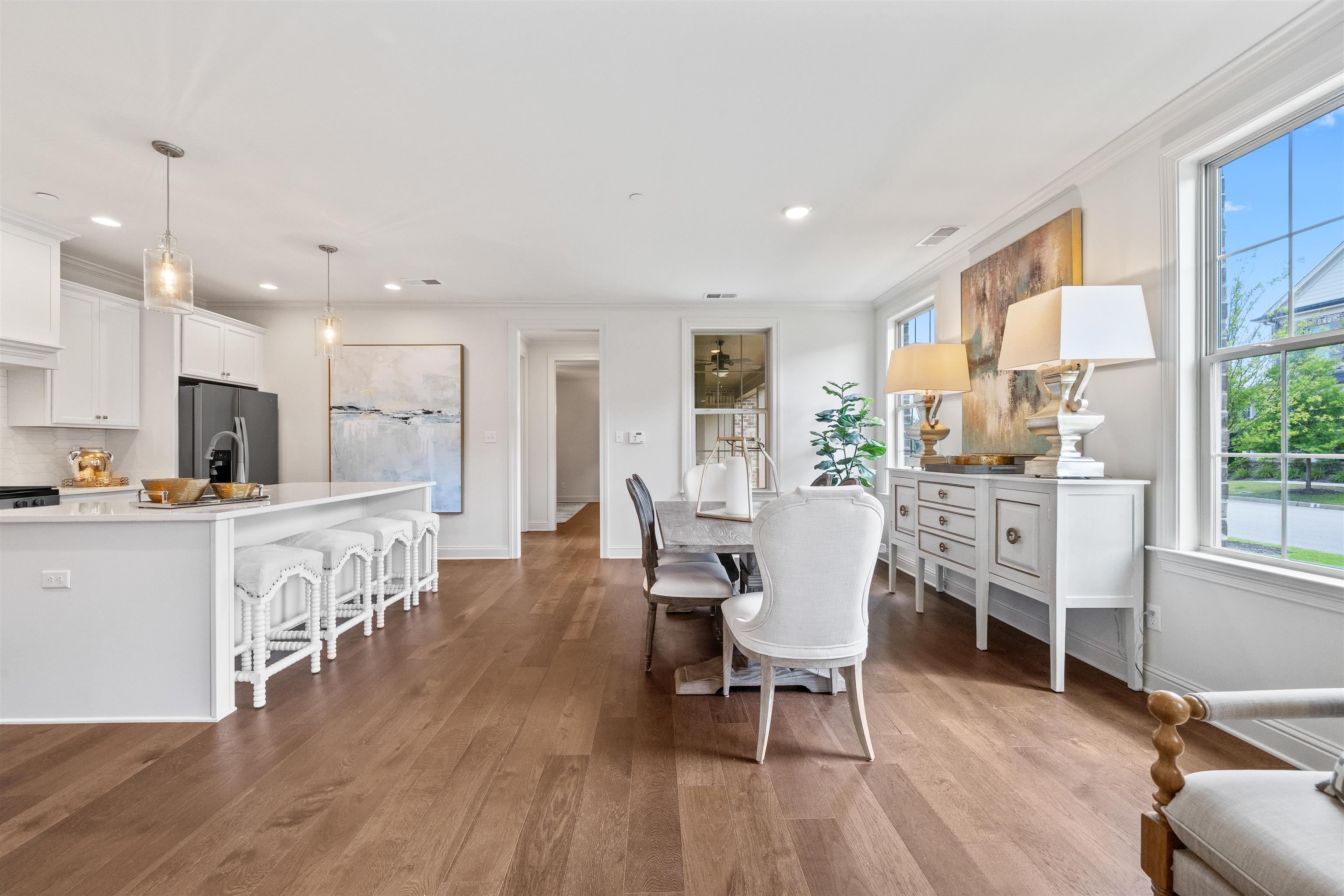 877 Ufton Alley Collierville, TN 38017 - Photo 14 of 36 a dining room with furniture and wooden floor