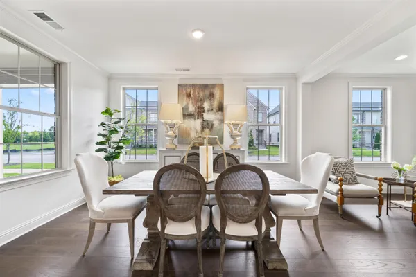 a dining room with furniture window wooden floor
