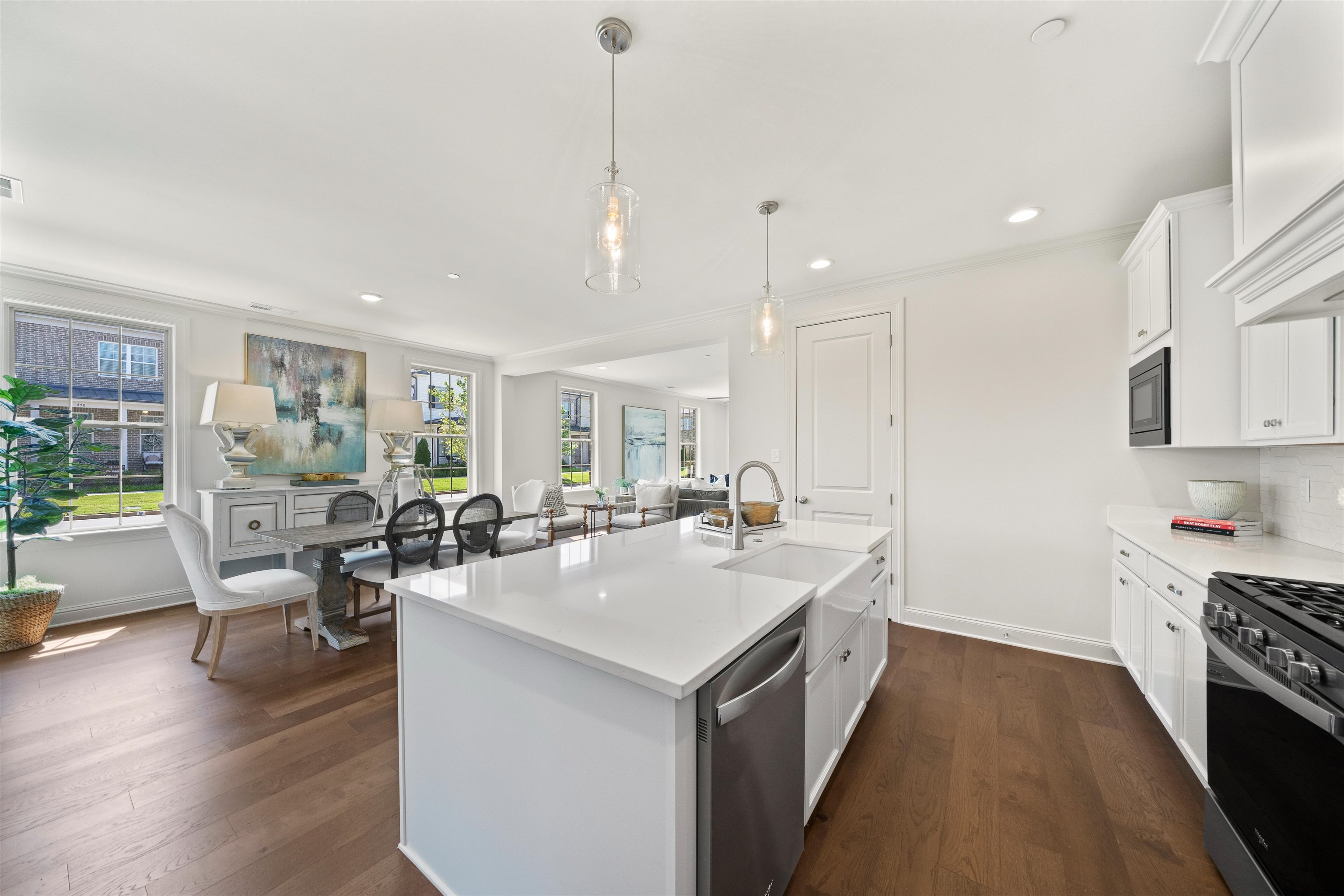 877 Ufton Alley Collierville, TN 38017 - Photo 20 of 36 a kitchen with a sink a counter and chairs