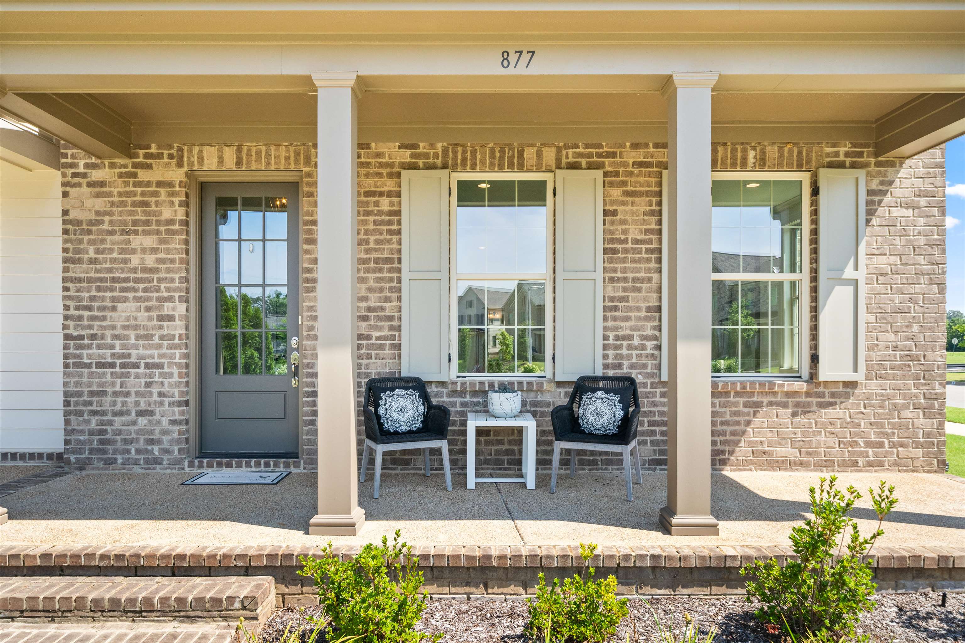 877 Ufton Alley Collierville, TN 38017 - Photo 7 of 36 a front view of a house with outdoor seating