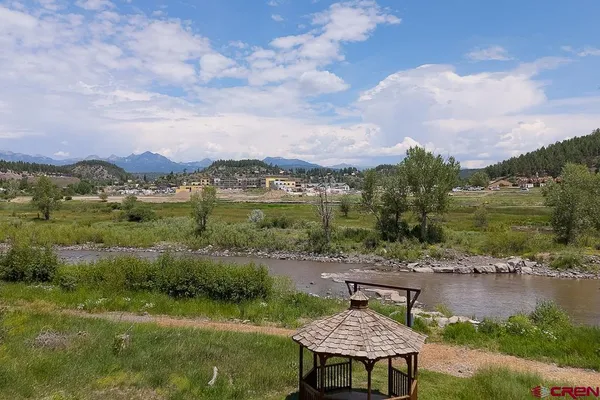 a view of a lake with a yard