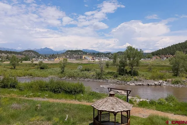 a view of a lake with a yard