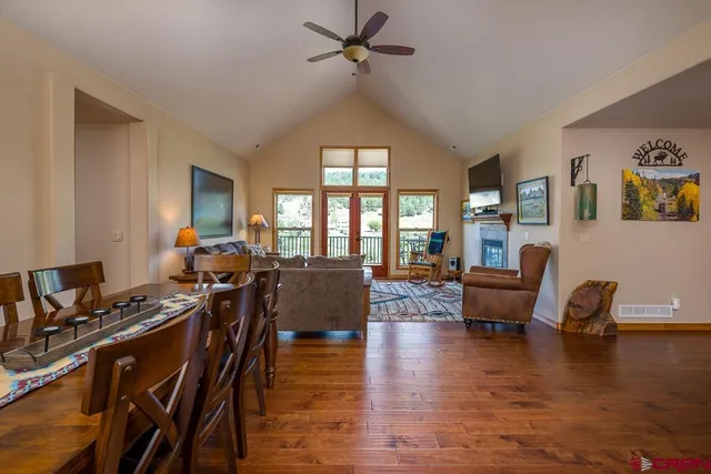 a living room with furniture or couch and a wooden floor
