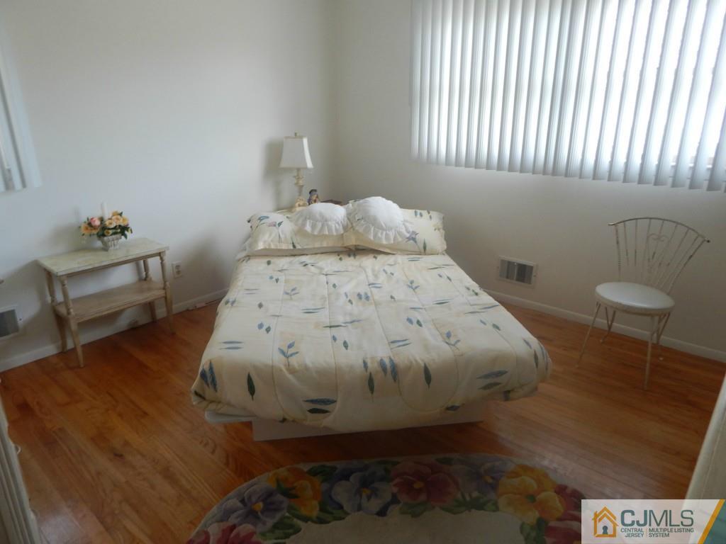 41 Harmon Road Edison, NJ 08837 - Photo 14 of 20 a bedroom with a bed and a window