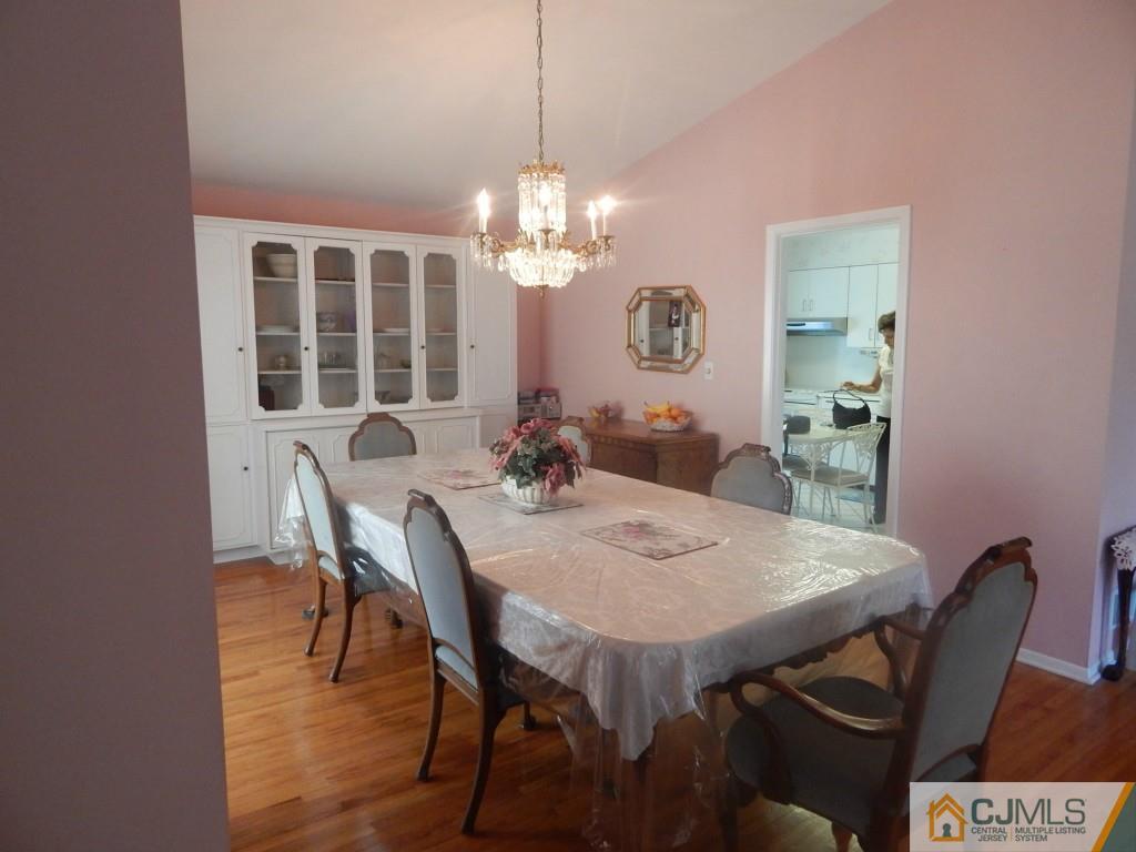 41 Harmon Road Edison, NJ 08837 - Photo 8 of 20 a view of a dining room with furniture and chandelier