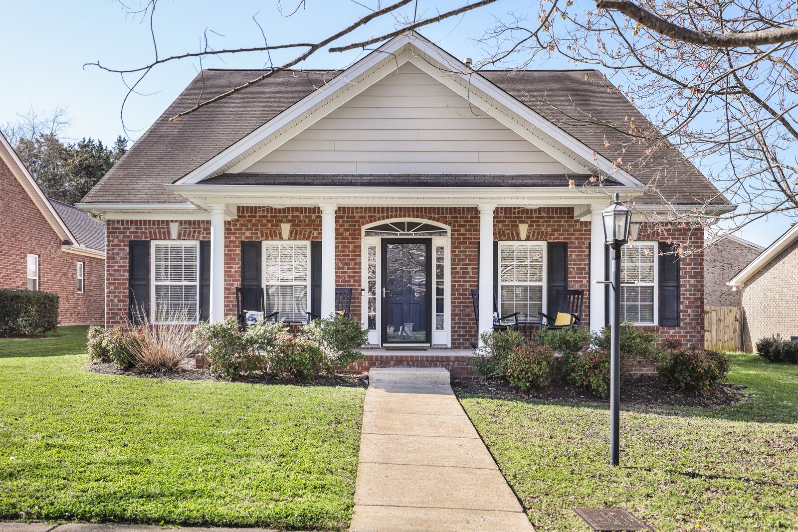 a front view of a house with garden