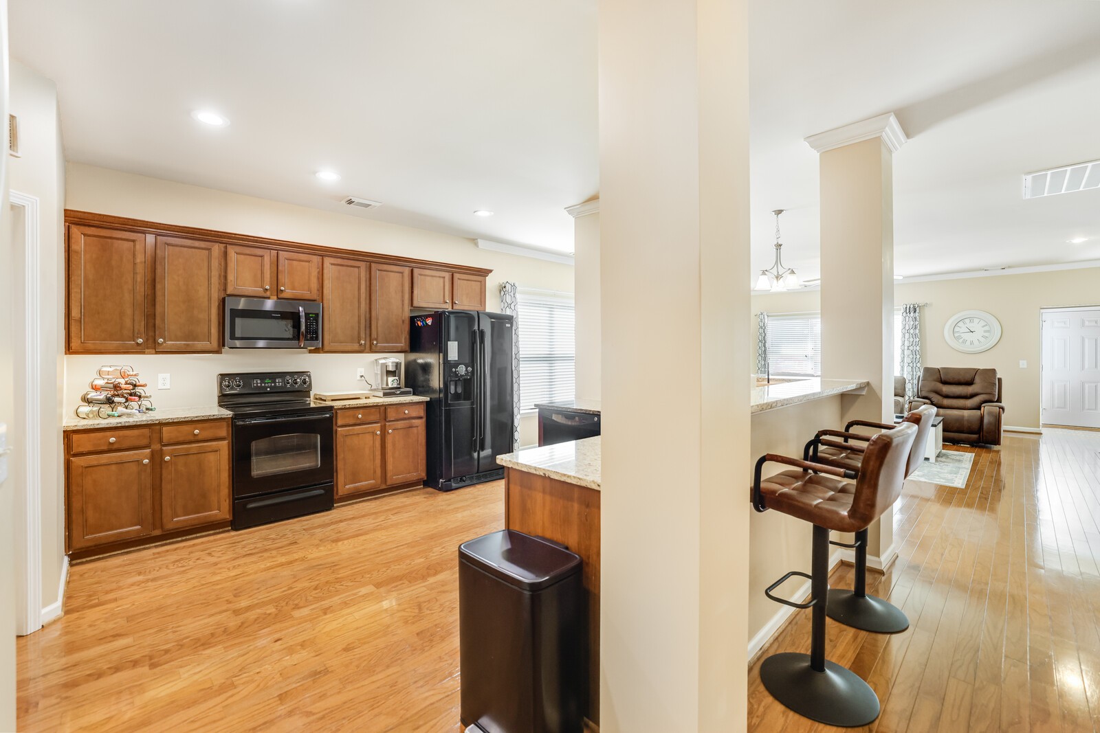 5239 New John Hagar Road Hermitage, TN 37076 - Photo 12 of 70 a kitchen with stainless steel appliances granite countertop a stove refrigerator and a sink