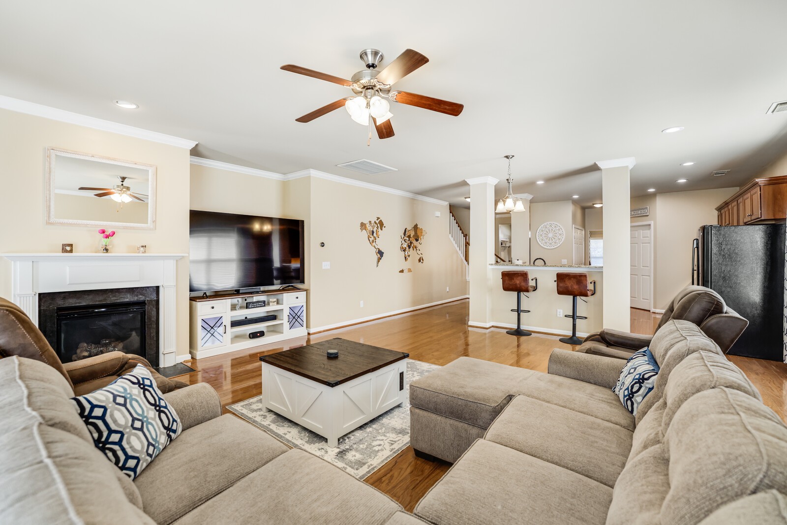 5239 New John Hagar Road Hermitage, TN 37076 - Photo 26 of 70 a living room with furniture a fireplace and a flat screen tv