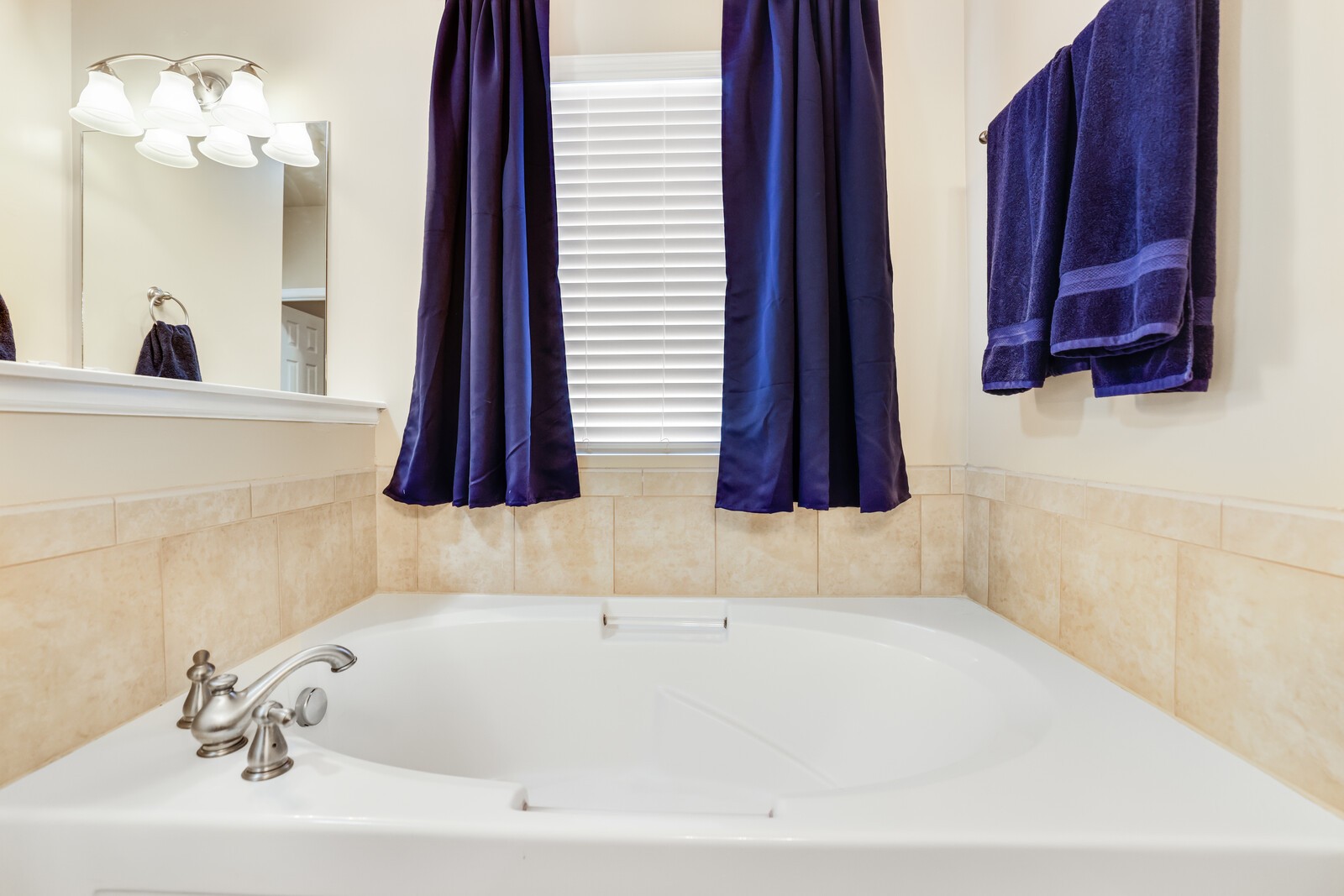 5239 New John Hagar Road Hermitage, TN 37076 - Photo 34 of 70 a bathroom with a bathtub a sink and a window
