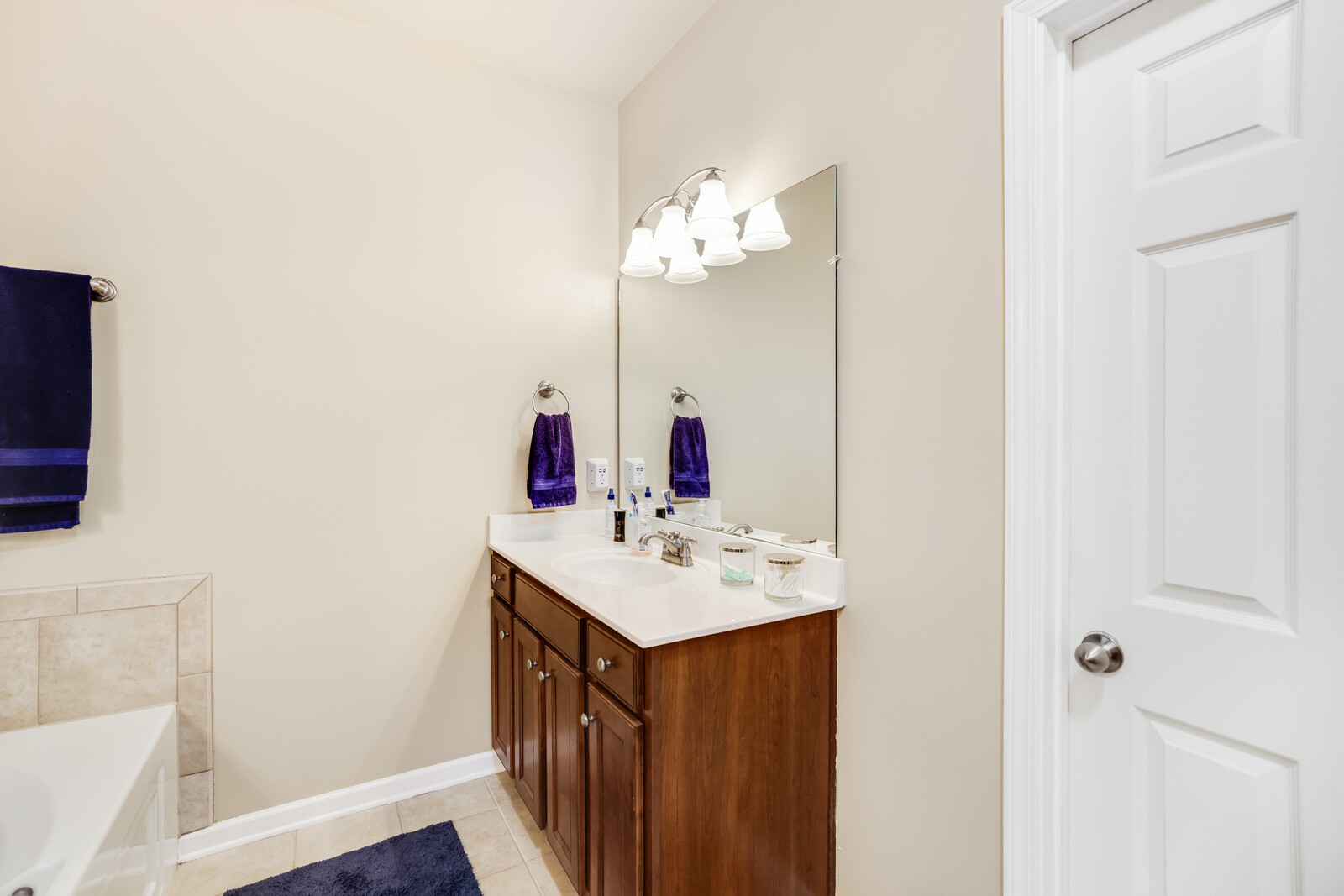 5239 New John Hagar Road Hermitage, TN 37076 - Photo 35 of 70 a bathroom with a sink a mirror and a toilet