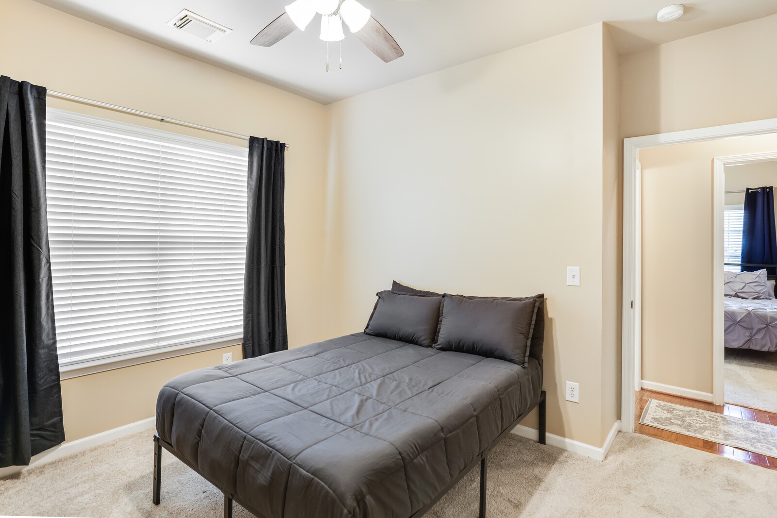 5239 New John Hagar Road Hermitage, TN 37076 - Photo 40 of 70 a bedroom with a bed and a chandelier