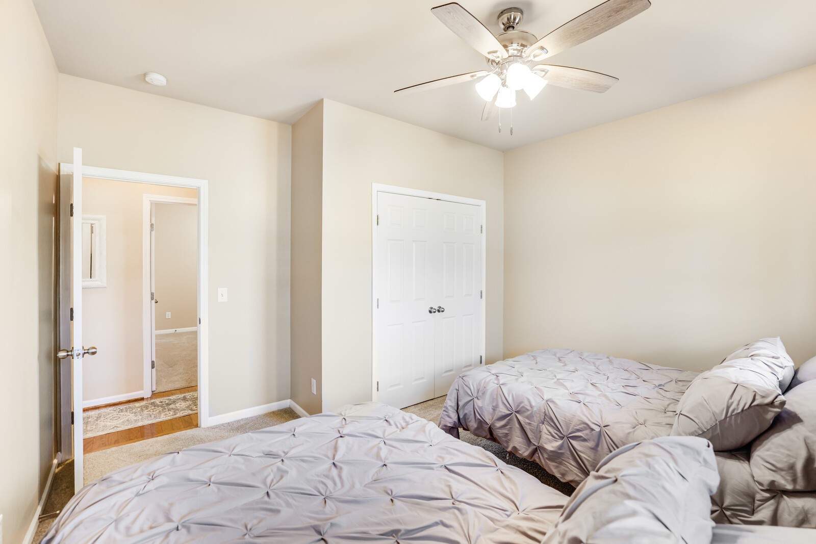 5239 New John Hagar Road Hermitage, TN 37076 - Photo 43 of 70 a bedroom with a large bed and a chandelier