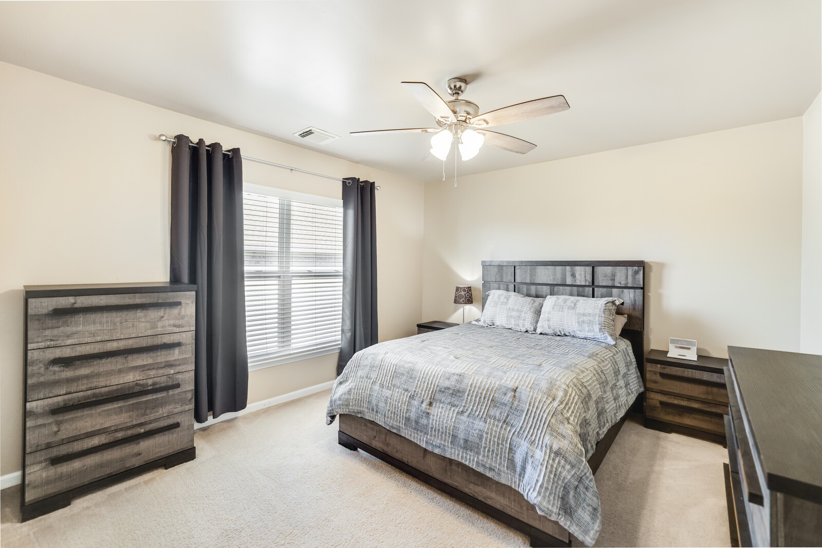5239 New John Hagar Road Hermitage, TN 37076 - Photo 50 of 70 a bedroom with a large bed and a chandelier