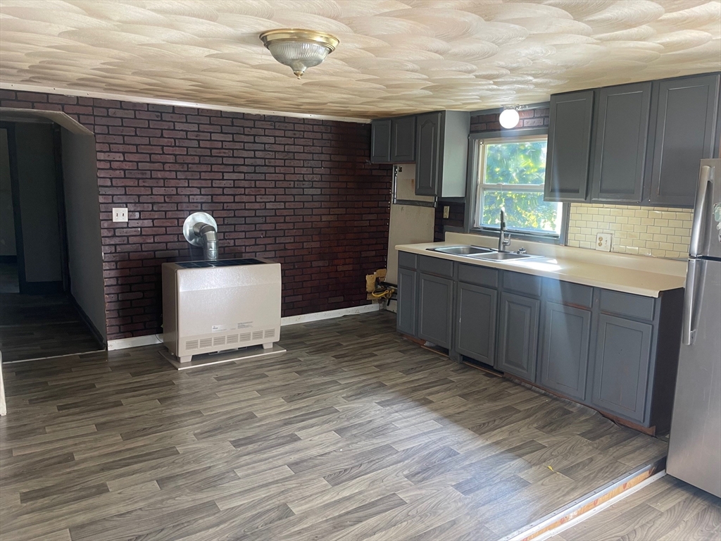 3216 North Main Street Fall River, MA 02720 - Photo 22 of 42 a bathroom with a sink and a mirror